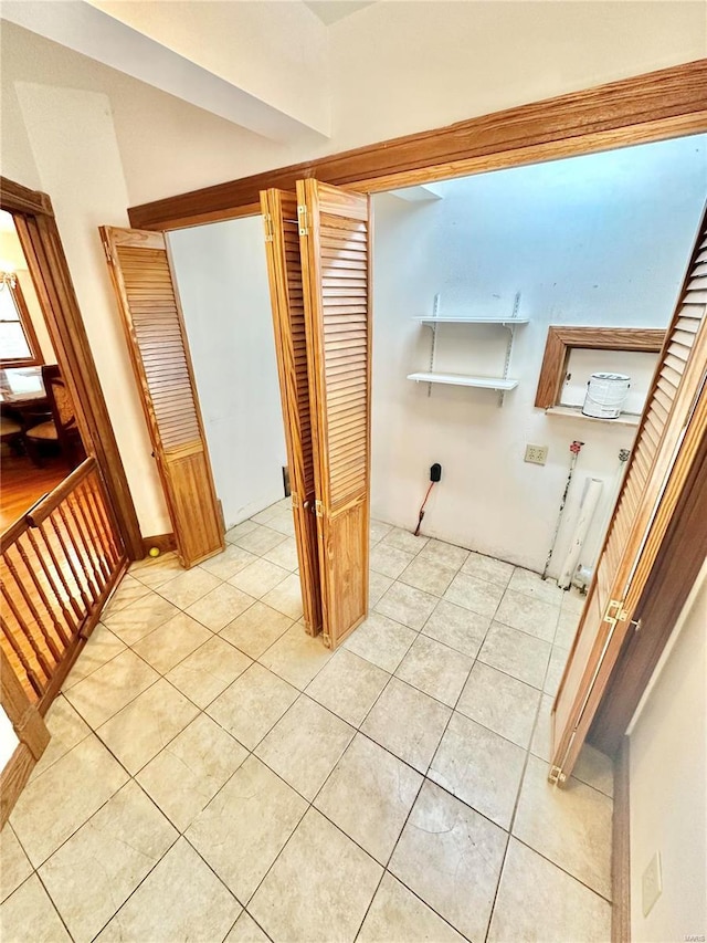 washroom featuring laundry area, light tile patterned flooring, hookup for a washing machine, and electric dryer hookup