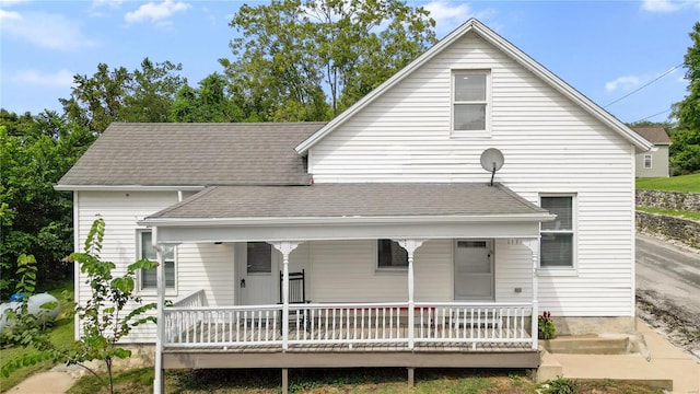 back of property featuring a porch