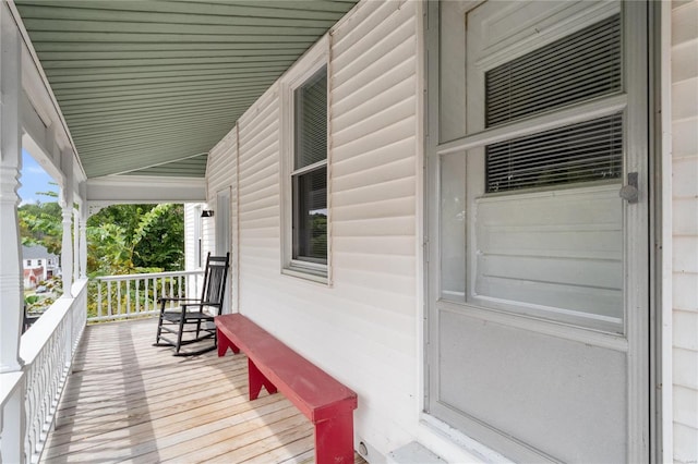 wooden terrace featuring a porch