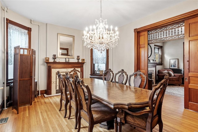 dining room featuring a chandelier and light hardwood / wood-style floors