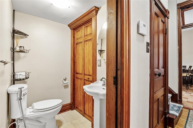 bathroom featuring sink and toilet