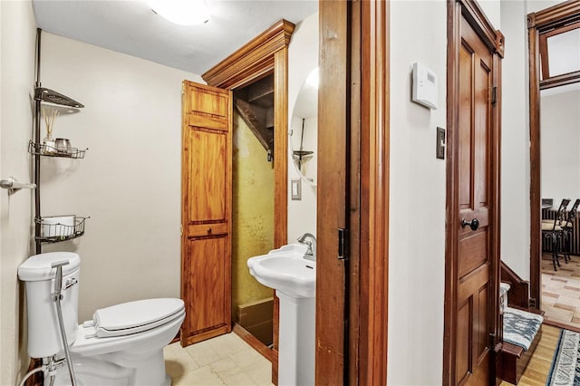 bathroom with sink and toilet