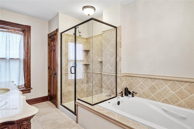 bathroom featuring tile patterned floors, separate shower and tub, and sink