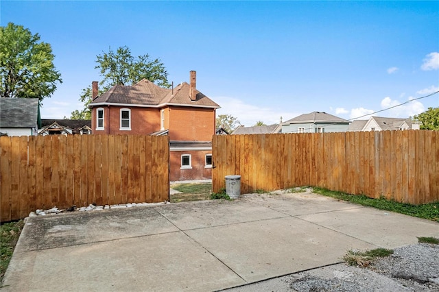 view of side of home with a patio