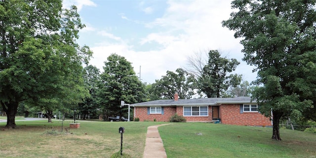 ranch-style house featuring a front lawn