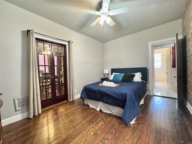 bedroom featuring french doors, ceiling fan, and dark hardwood / wood-style flooring