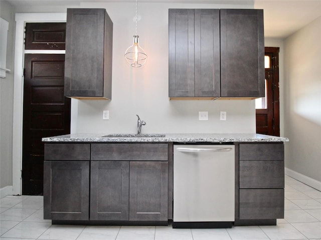 kitchen featuring decorative light fixtures, stainless steel dishwasher, dark brown cabinets, and light stone counters