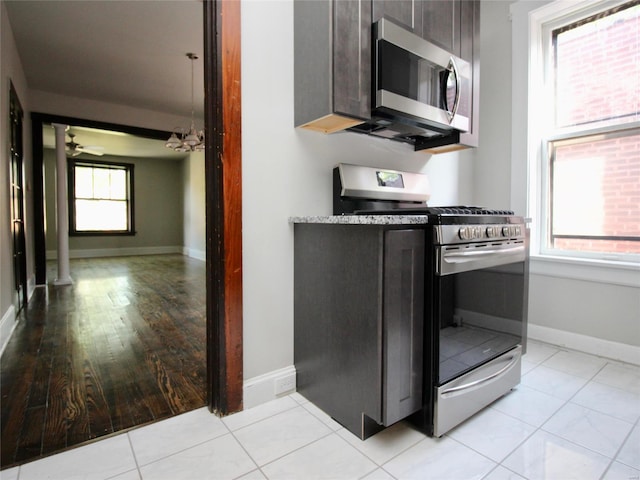 kitchen featuring light hardwood / wood-style flooring, a healthy amount of sunlight, and stainless steel appliances