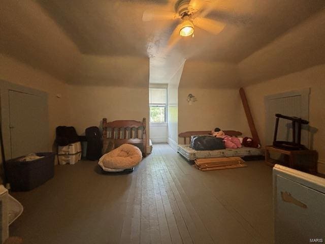 bedroom featuring hardwood / wood-style flooring and ceiling fan