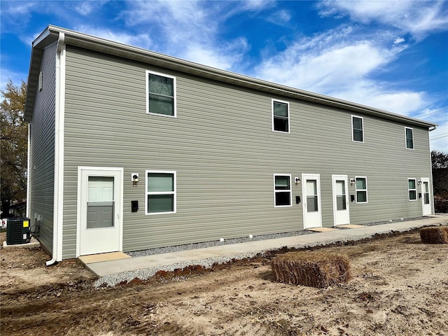 back of property with central AC unit