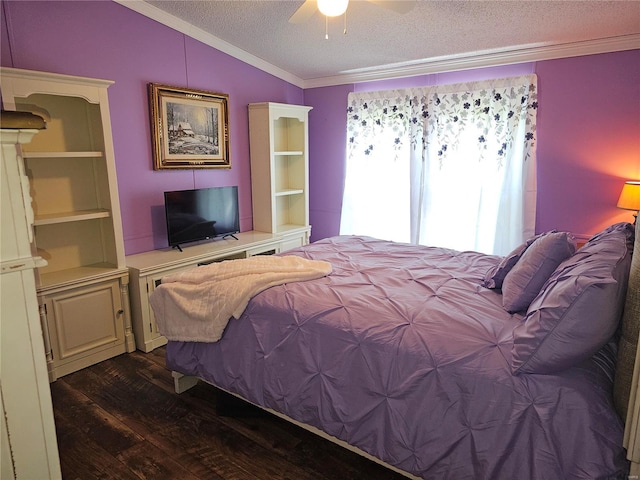 bedroom featuring lofted ceiling, ceiling fan, ornamental molding, dark wood-type flooring, and a textured ceiling