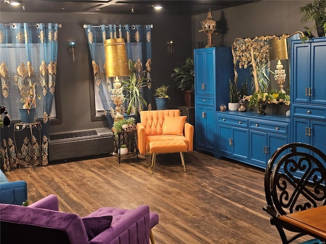 sitting room with dark wood finished floors