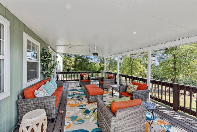 wooden terrace with outdoor lounge area