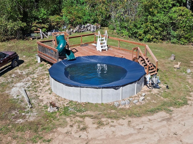 view of swimming pool with a wooden deck