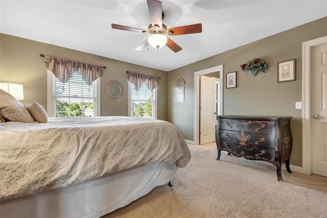 bedroom with carpet floors, baseboards, and a ceiling fan