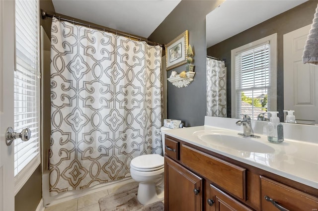 full bathroom with toilet, curtained shower, vanity, and tile patterned floors