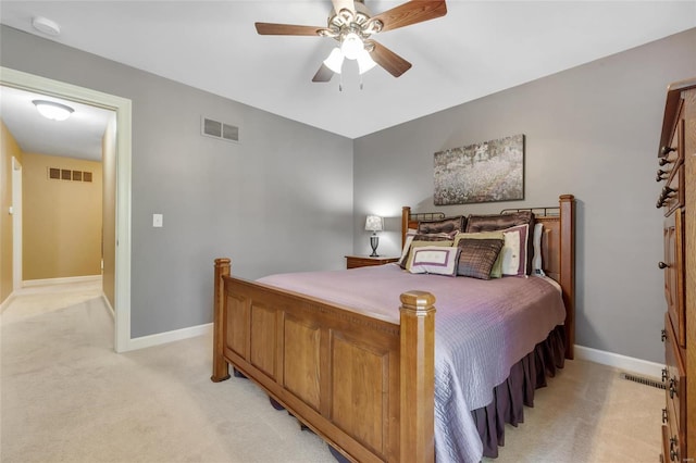 bedroom featuring light carpet, baseboards, and visible vents