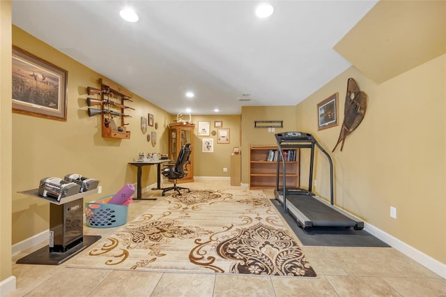 exercise room with recessed lighting, baseboards, and tile patterned floors