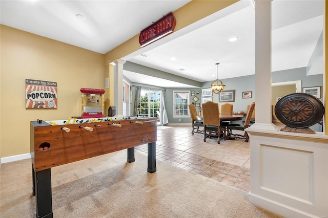 recreation room with light carpet, decorative columns, baseboards, light tile patterned flooring, and recessed lighting