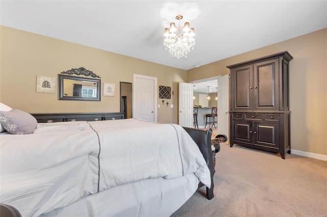 bedroom featuring light colored carpet, baseboards, and an inviting chandelier