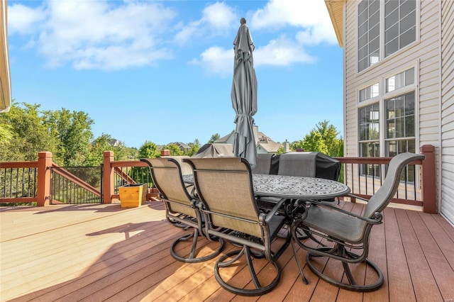 wooden terrace featuring outdoor dining area