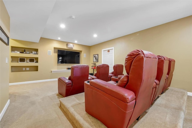 home theater room featuring baseboards, recessed lighting, and light colored carpet