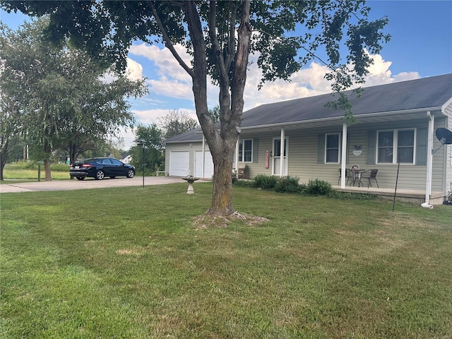 ranch-style house featuring a garage, a porch, concrete driveway, and a front yard