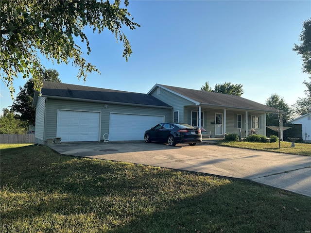 single story home featuring a front lawn, covered porch, and a garage