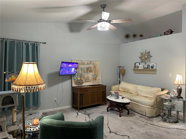 living room with baseboards and a ceiling fan