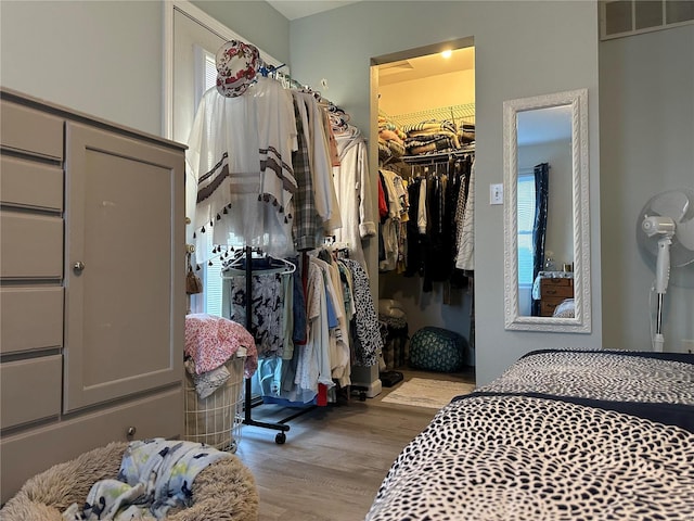 spacious closet with visible vents and wood finished floors