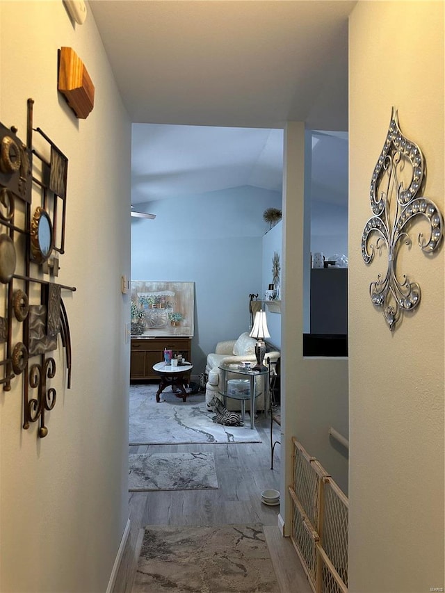 corridor featuring wood finished floors