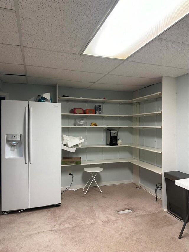 office area featuring a drop ceiling and carpet