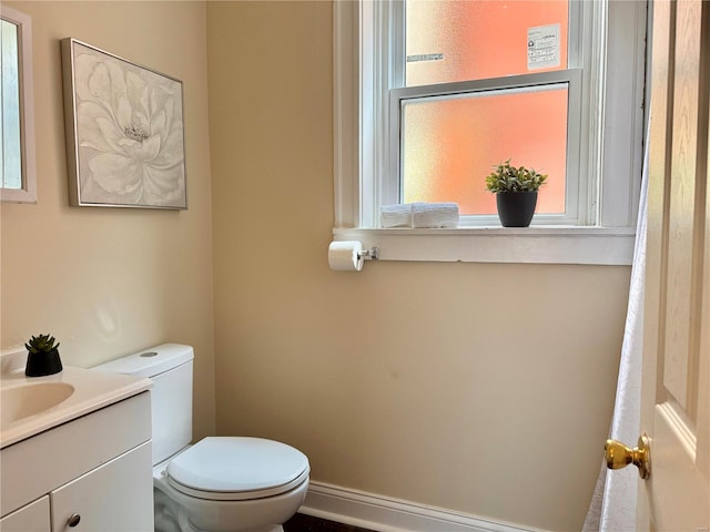 bathroom featuring toilet and vanity