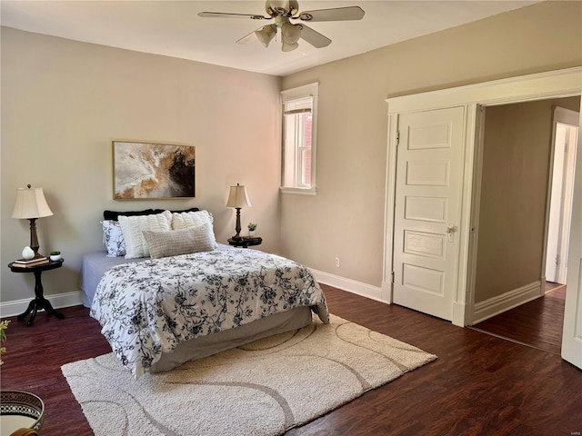 bedroom with ceiling fan and dark hardwood / wood-style flooring