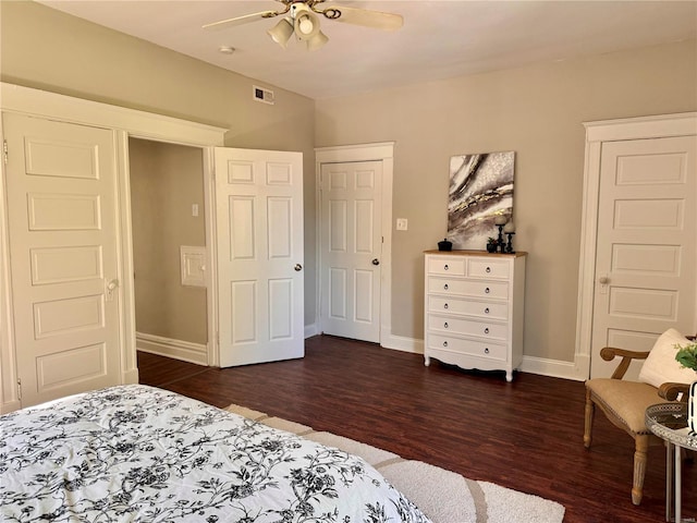 bedroom with dark wood-type flooring, a closet, and ceiling fan