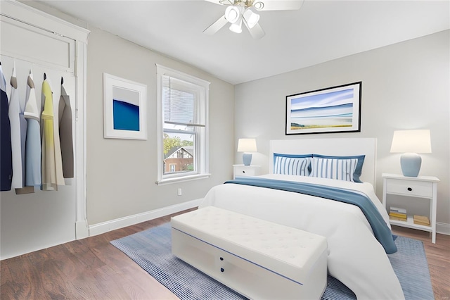 bedroom featuring dark hardwood / wood-style flooring and ceiling fan