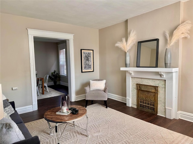 sitting room with dark hardwood / wood-style flooring