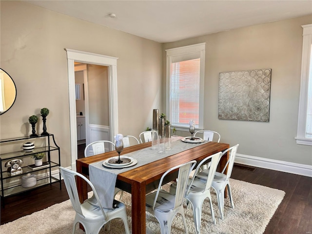 dining room featuring dark hardwood / wood-style flooring