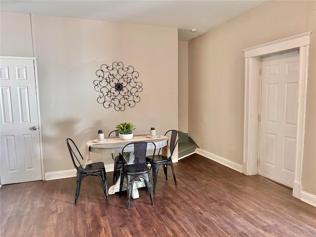 dining room with dark wood-type flooring