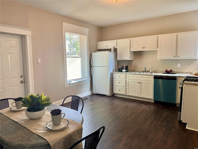 kitchen with white cabinetry, stainless steel appliances, sink, and dark hardwood / wood-style floors