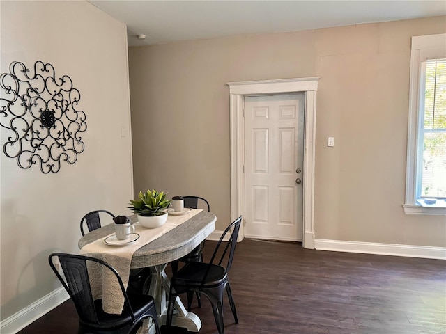 dining room with dark wood-type flooring