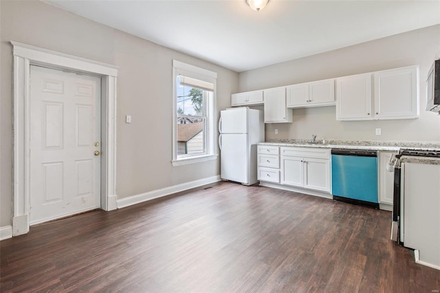 kitchen with light stone countertops, dark wood-type flooring, appliances with stainless steel finishes, and white cabinets