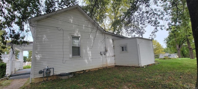 view of property exterior with a yard