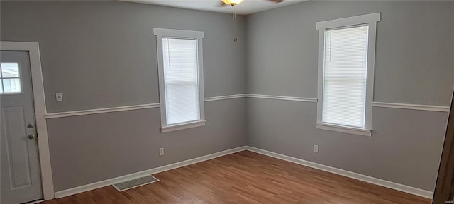 interior space featuring hardwood / wood-style floors and ceiling fan