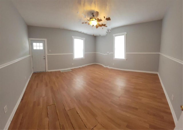 spare room featuring light hardwood / wood-style flooring