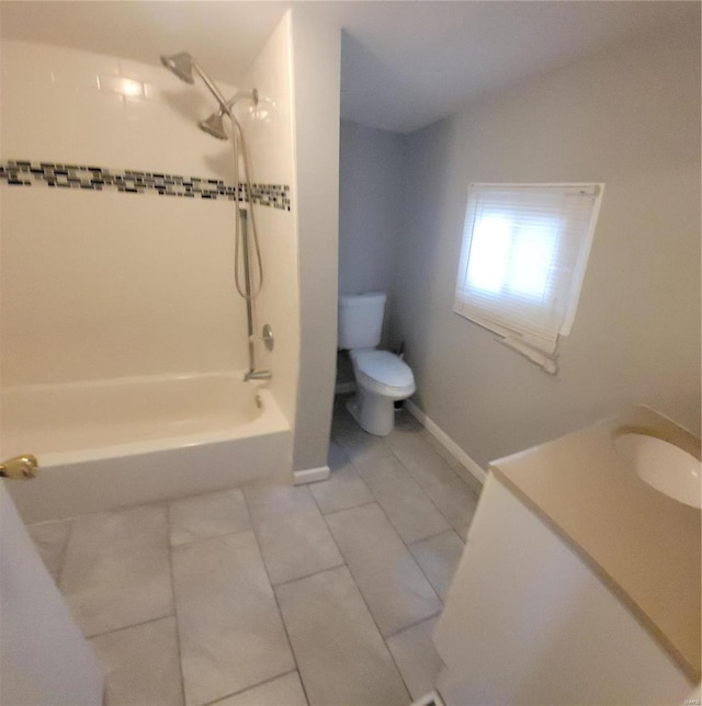 full bathroom with vanity, toilet,  shower combination, tile patterned floors, and lofted ceiling