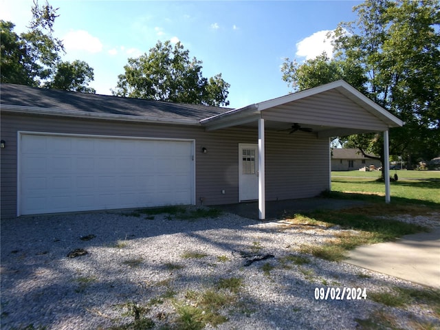 ranch-style house featuring a garage and a front lawn