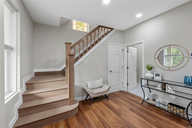 staircase featuring hardwood / wood-style floors