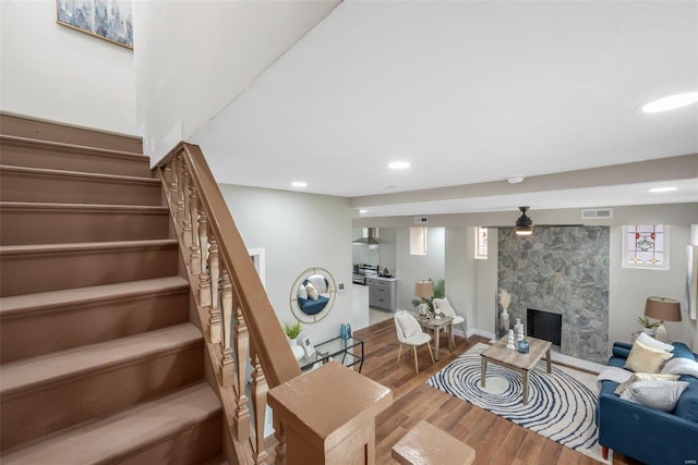 living room featuring hardwood / wood-style flooring and a fireplace