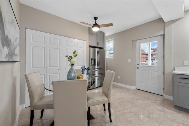 dining space with ceiling fan